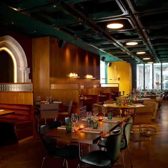 Main Bar at One Over the Ait, featuring private booths for corporate dinners and networking events.