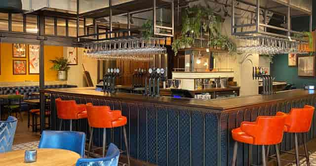 Mezzanine at The White Horse Wembley: modern industrial venue for networking and conferences.