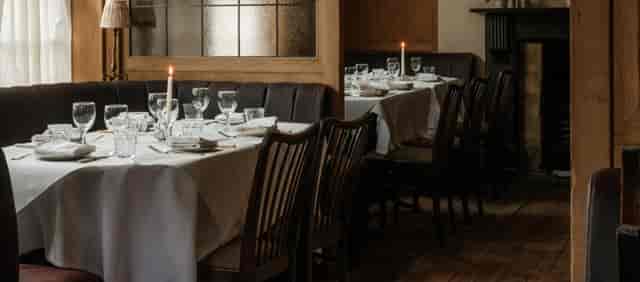 Private dining at The White Horse Wembley with formal table settings for corporate events.