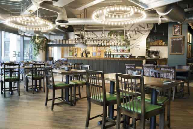 Industrial-chic Snug lounge at The White Horse Wembley, perfect for networking events and mixers.