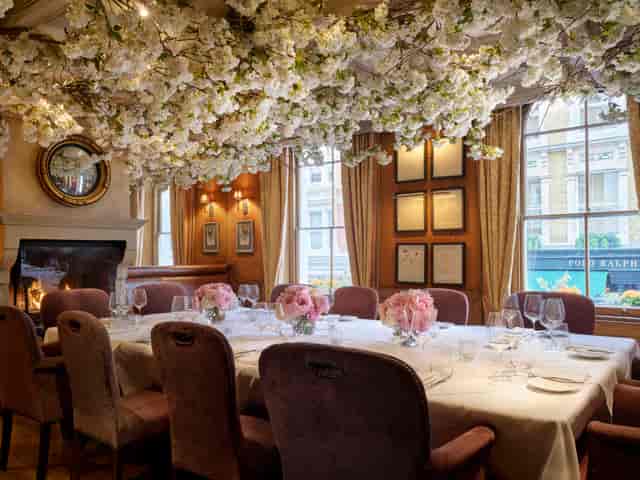 Clos Maggiore private dining room with floral canopy for luxury VIP events and board dinners.
