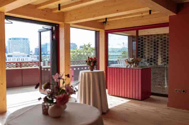 The Old Vic event space with high-top tables for an intimate cocktail reception and networking.