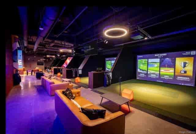 Five Iron Golf venue for corporate team building and networking events with high-tech simulators.