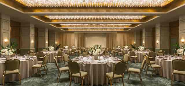 Pillar-free ballroom with crystal chandeliers for luxury gala and formal banquet events.