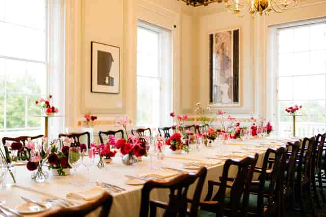 Intimate dinner setup with floral centerpieces in historic St Richard’s Church, private event venue.