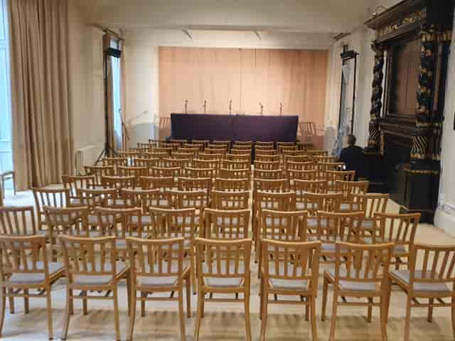 Theater-style stage in Orchard Gardens Community Centre for corporate events and conferences.
