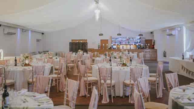 Main Hall at St. Thomas' Church wedding setup with elegant Chiavari chairs and bar area.