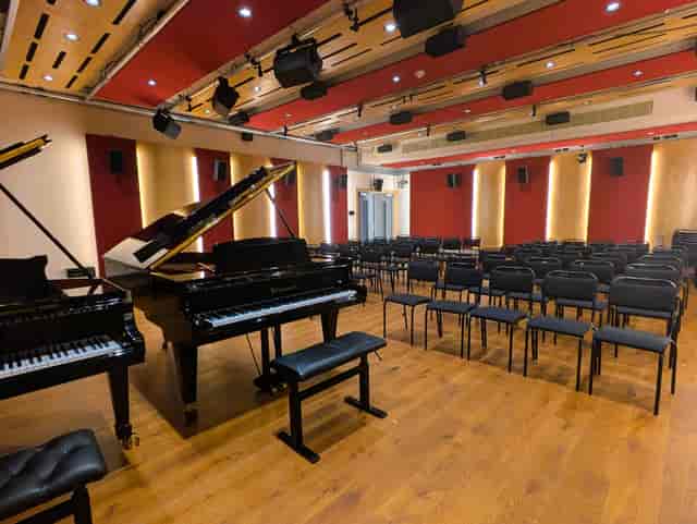 Grand piano on stage in Royal Academy of Music recital hall for corporate events and masterclasses.