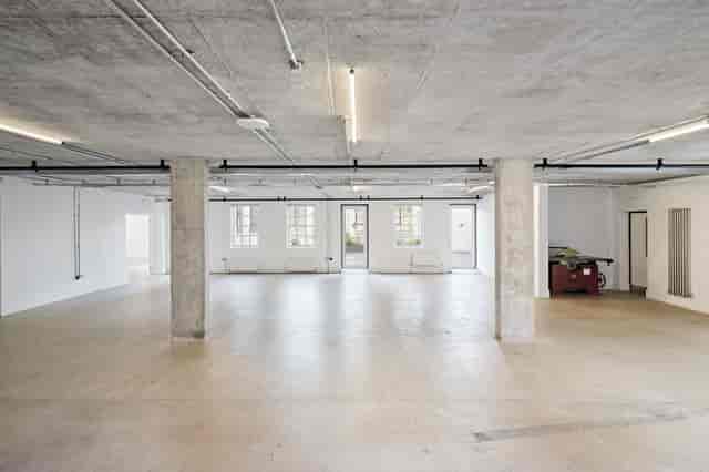 Industrial-chic Protein Studios blank canvas event space with concrete walls for creative hire.