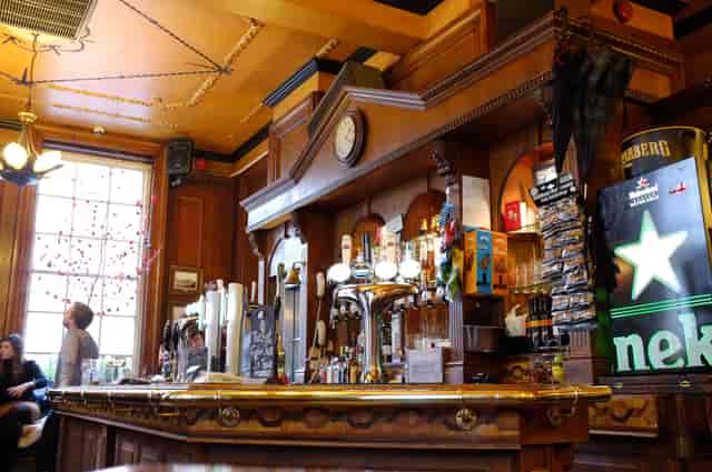 Wood-paneled pub venue at The Scottish Stores for intimate networking and breakout sessions.