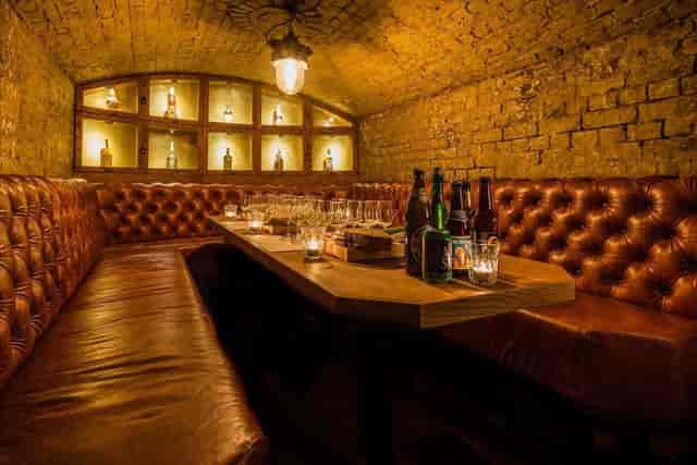Intimate private dining room at TT Liquor for VIP networking and corporate board dinners.
