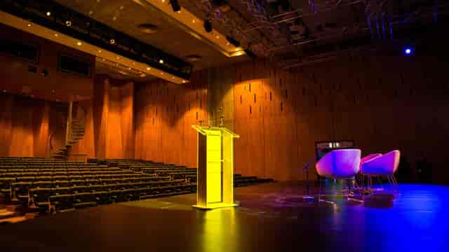 O2 Academy Islington auditorium featuring a podium and stage for corporate events and conferences.