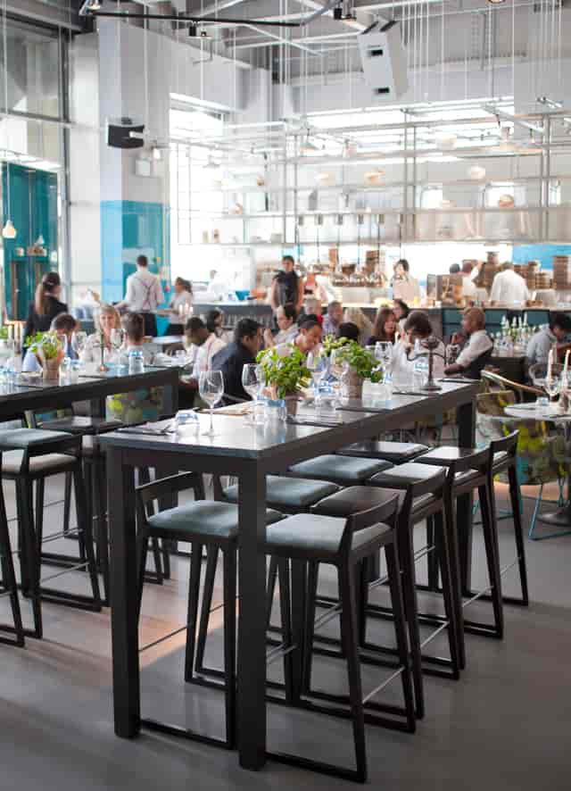Vibrant dining space at The Drift Bar with elegant table settings for events.