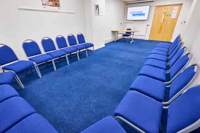 Sham Room in St Thomas Centre: circular blue chairs for workshops and meetings.