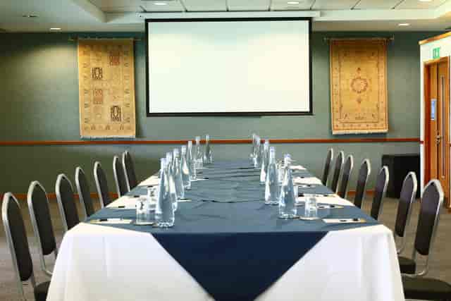 "Pakistan Room at Kia Oval: professional meeting setup with long table, ideal for workshops."