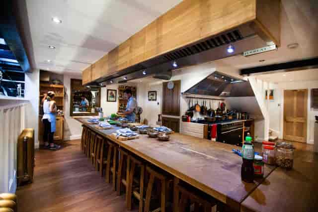 Spacious kitchen with central island for culinary events and cooking classes at Food at 52.