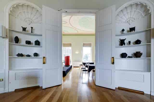 Elegant meeting space in Asia House with ornate double doors and unique artifacts.