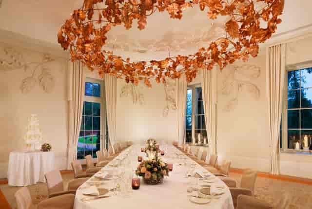 Elegant Oak Room dining setup with fine china, perfect for weddings and corporate events.