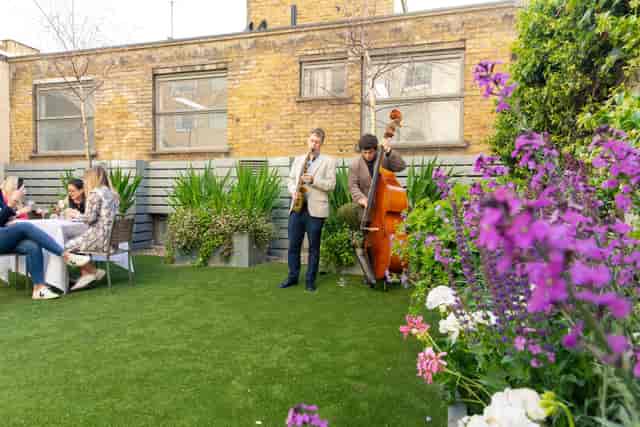Rooftop jazz garden event venue, lush greenery