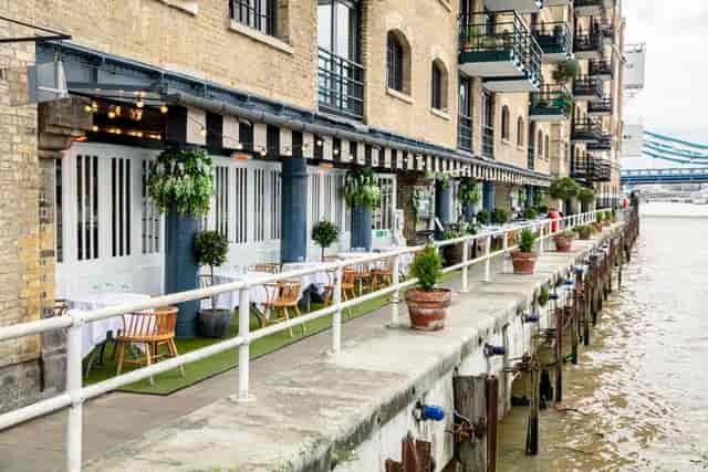 Charming waterfront venue at Butlers Wharf for outdoor events with elegant seating.