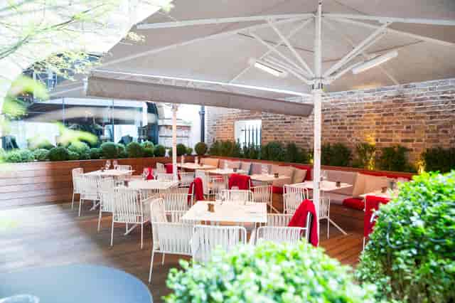 Stylish outdoor dining area at Old Bengal Bar, perfect for events and gatherings.