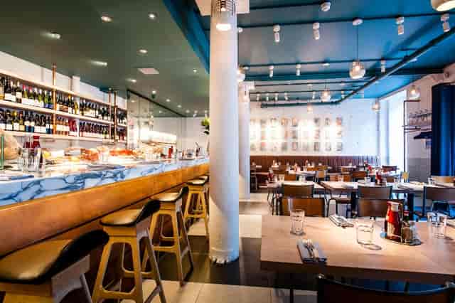 Modern restaurant venue in Fish Market, ideal for networking events and team lunches.