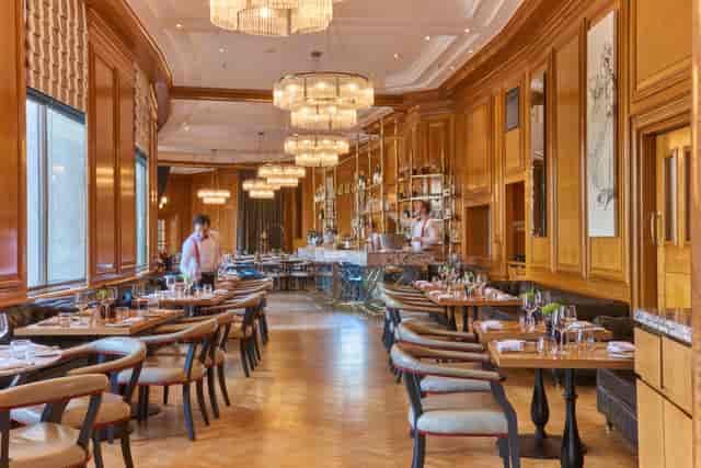 Gillray's Steakhouse dining area with warm wood paneling, ideal for upscale events and dinners.