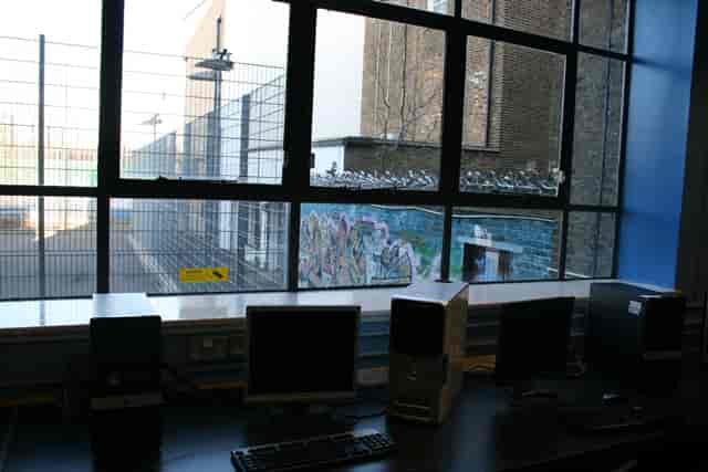 I.T. Suite at The Harrow Club with computers and large window for events and meetings.