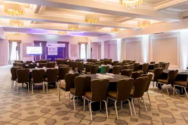 Crown & Cornwall Suite: elegant meeting space with round tables for corporate events.