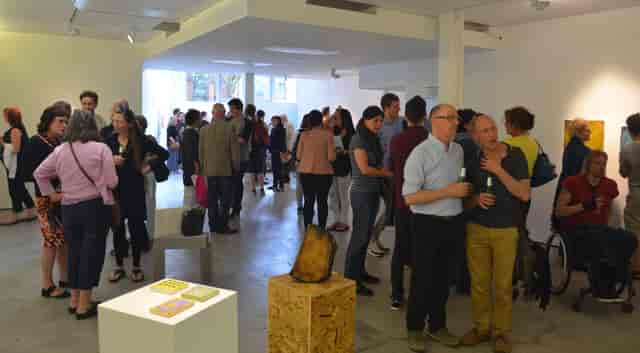 Vibrant Castlefield Gallery event with attendees networking and art installations.