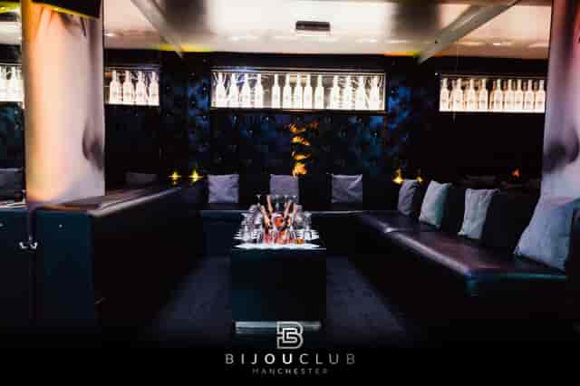 Stylish cocktail bar lounge with plush seating for upscale private events and mixers.