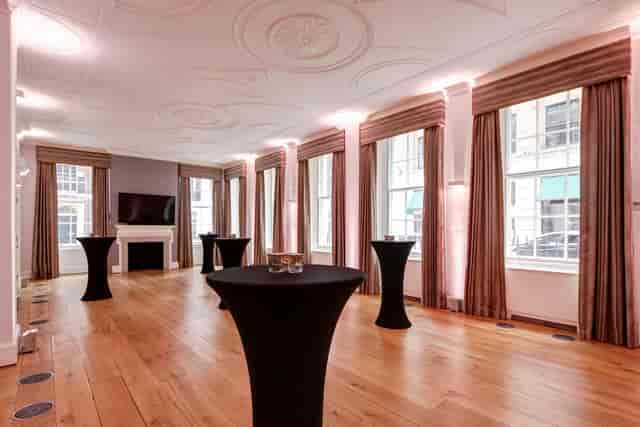 Elegant Tavern Room at RSA House with high-top tables for networking events.