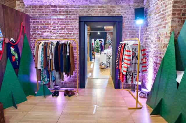 The Vaults at RSA House: vibrant pop-up shop with festive decor and exposed brick walls.