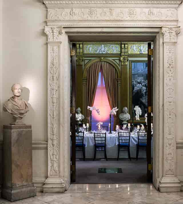 Elegant dining room with ornate architecture for upscale events and formal dinners.