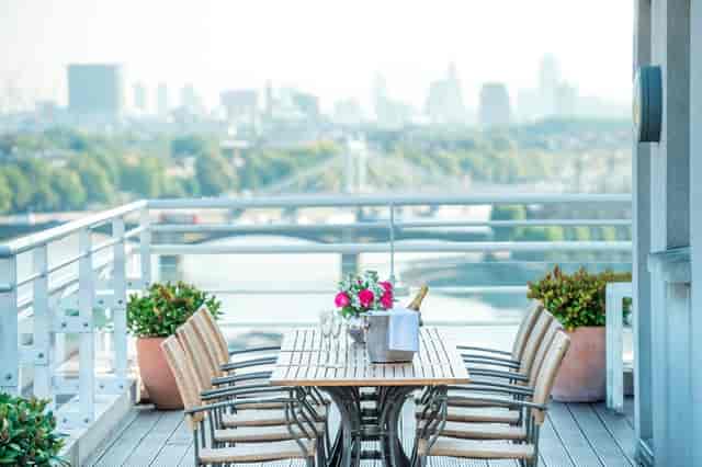 Executive Boardroom at Chelsea Harbour Hotel with floral centerpieces, ideal for meetings.