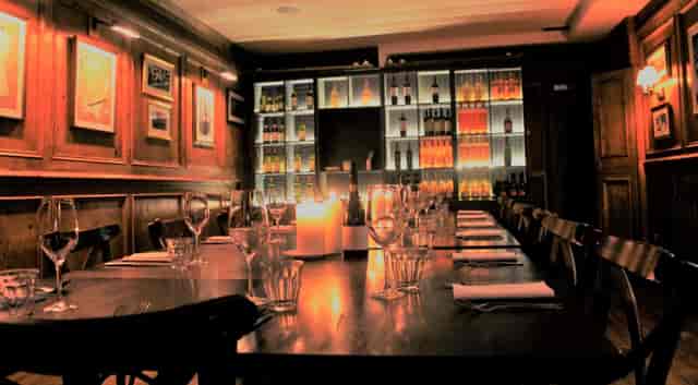 Private dining room at Brasserie Blanc, elegant setup for corporate dinner or private event.