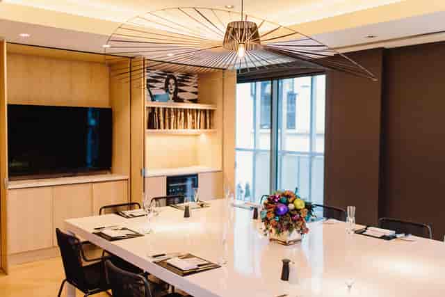Modern meeting room at South Place Hotel with sleek table, ideal for corporate events.