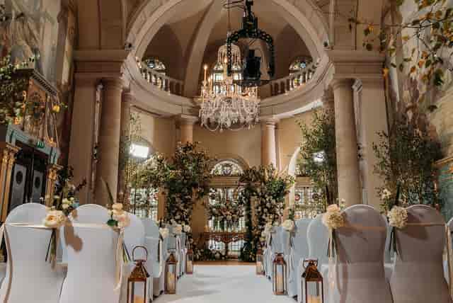 Elegant wedding ceremony in Main Reception Room, One Moorgate Place with floral accents.