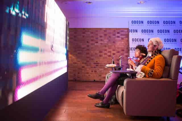 Cozy upscale viewing area at The Queen Charlotte for private screenings and events.