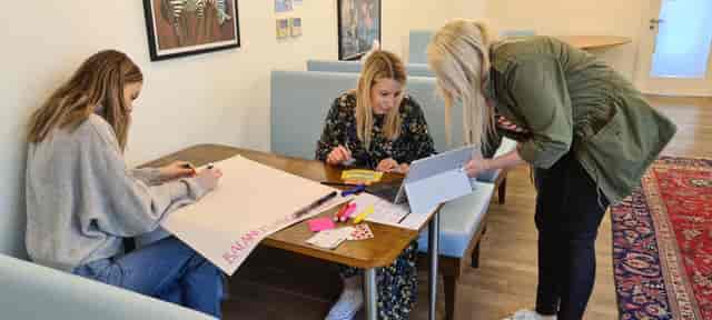 Ginger leading a creative brainstorming session with sticky notes at Wallacespace Clerkenwell.