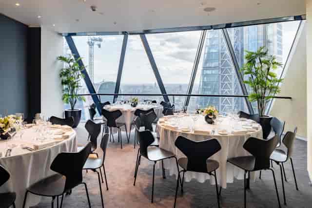 Sophisticated event space with skyline view, ideal for corporate meetings and celebrations.