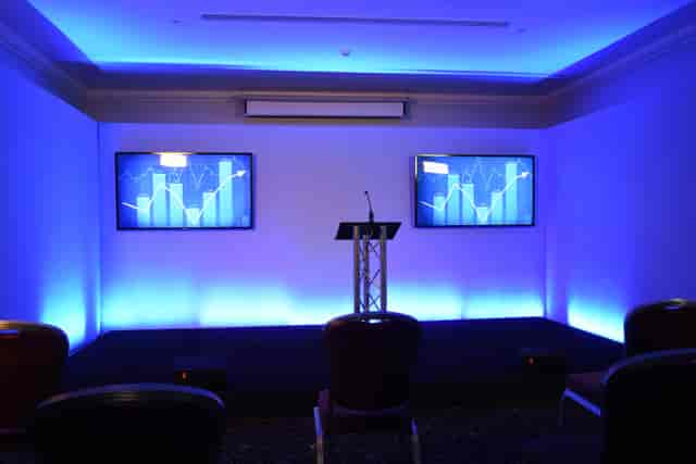 St James Suite at The Cavendish London with dual screens for corporate events.