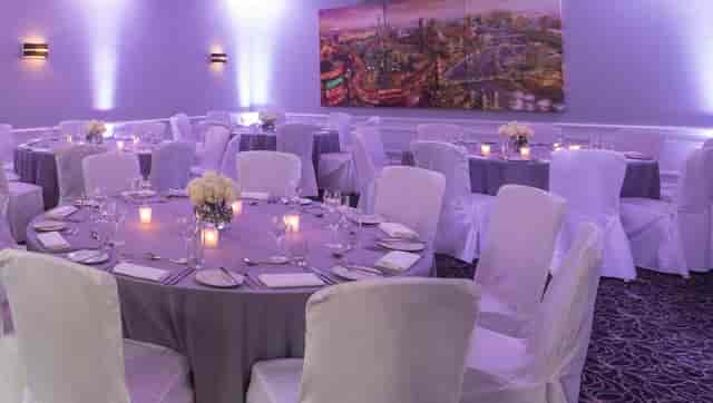 Elegant St James Suite banquet room with gray linens, ideal for corporate events and celebrations.