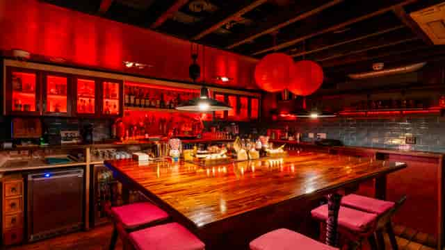 Vibrant bar at The Academy, ideal for networking events and cocktail receptions.