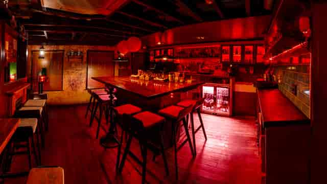 Stylish bar at Opium Cocktail & Dim Sum, perfect for intimate networking events.
