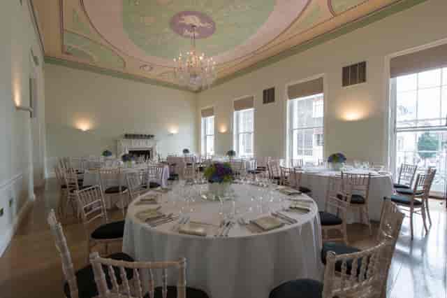 Elegant event space in Asia House with round tables, ideal for weddings and corporate events.