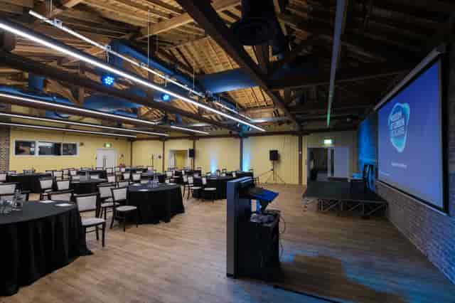 Wilberforce Room at London Museum Docklands, featuring rustic beams for events and meetings.