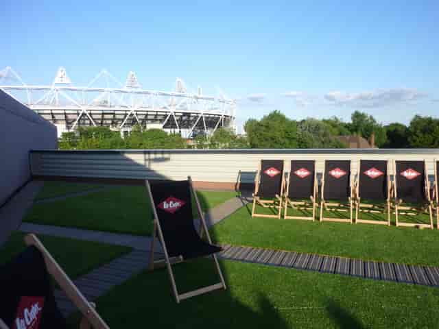 Smokehouse Gallery outdoor event space with deck chairs, ideal for summer gatherings.