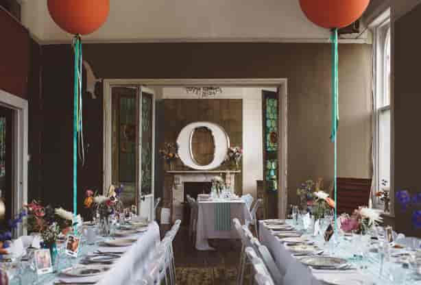 Intimate event banquet setup at The Roost with vertical balloon decor for weddings and parties.