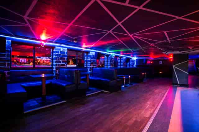 Modern event space at Bar Rumba with vibrant lighting for dynamic gatherings.